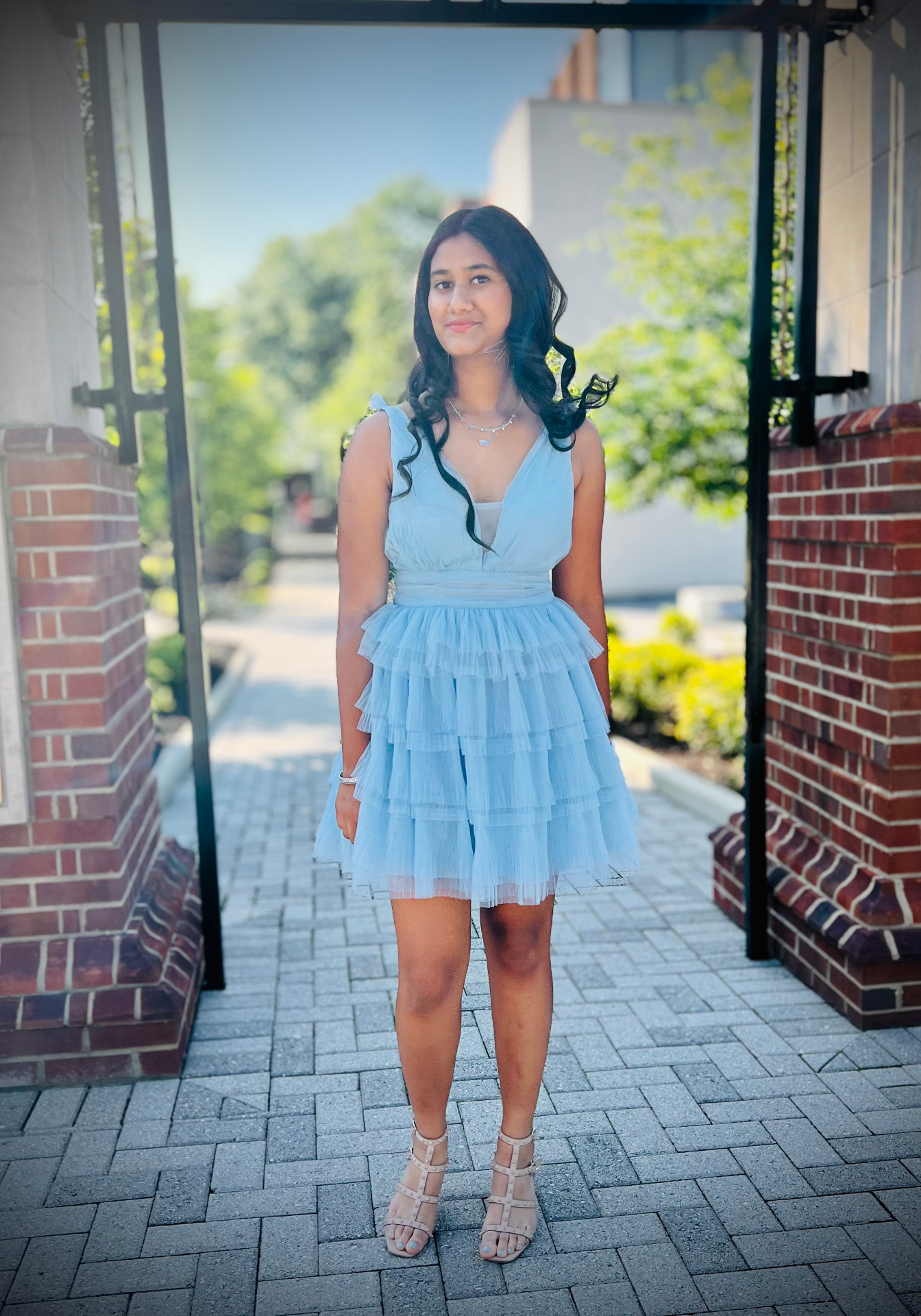 Navya in a tiered blue tulle dress
